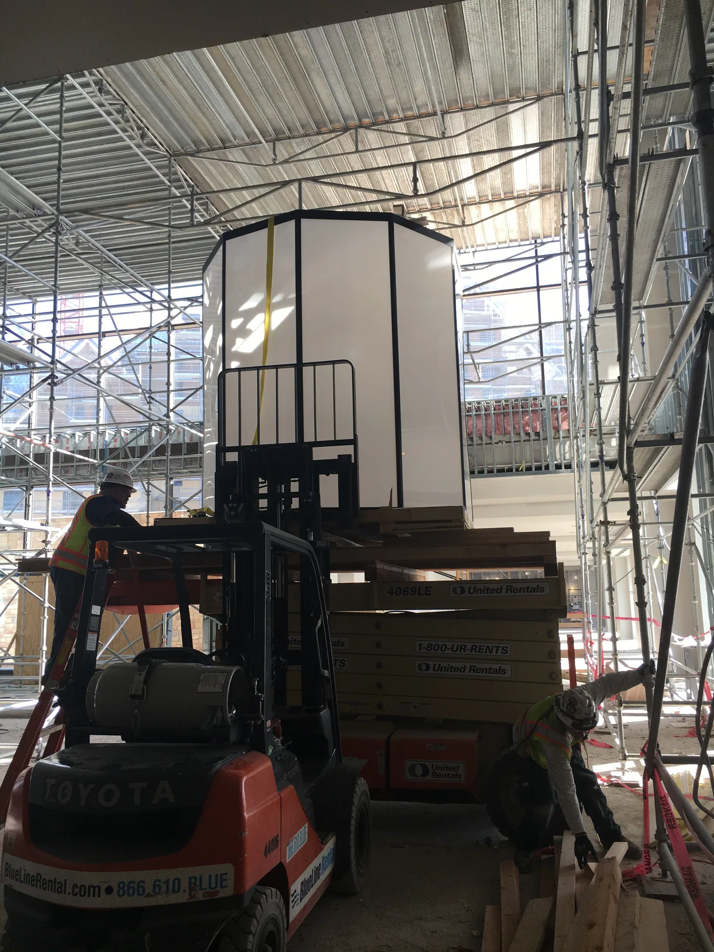 Large equipment being positioned inside a complex construction project